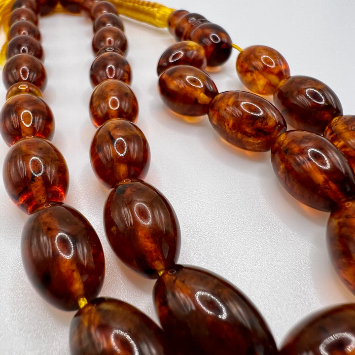 Oval Shape Cut Pressed Amber Baltic Tasbih Beads - Al Ali Gems