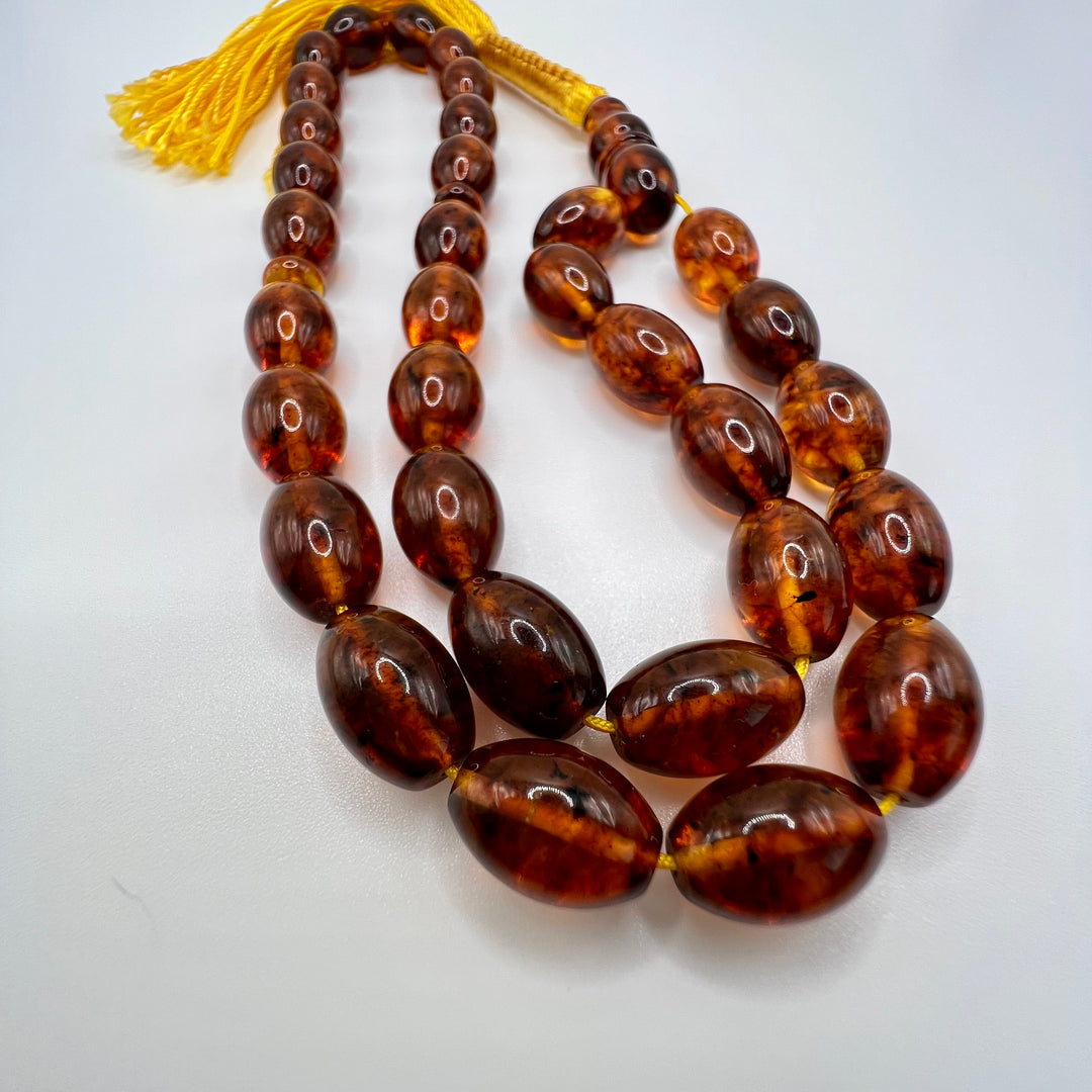 Oval Shape Cut Pressed Amber Baltic Tasbih Beads - Al Ali Gems